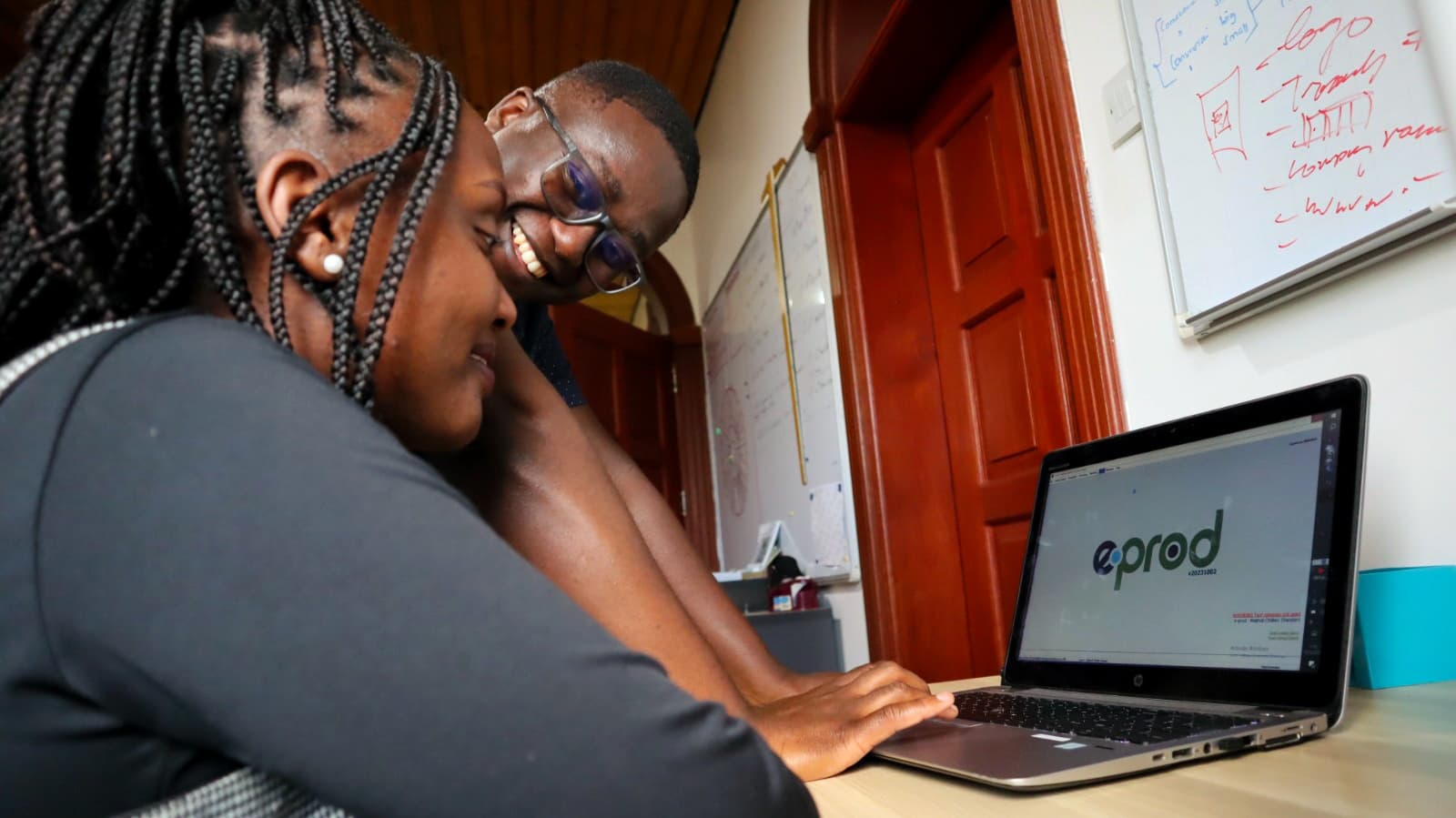 African farmer using mobile technology in a green agricultural field with digital data overlays